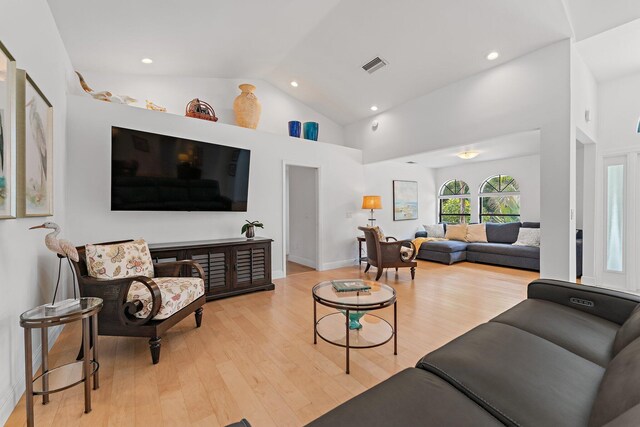 1488 SE Colony Way, Jupiter, FL 33478 - living room with light wood-type flooring, high vaulted ceiling, and recessed lighting
