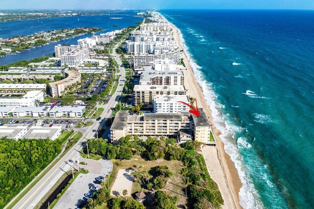 aerial view featuring a water view and a view of the beach