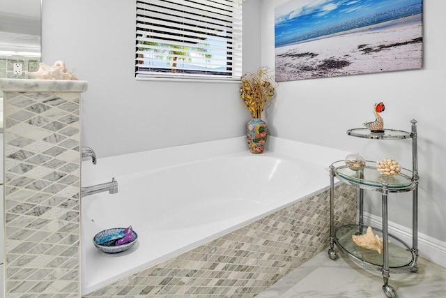 bathroom featuring a relaxing tiled tub