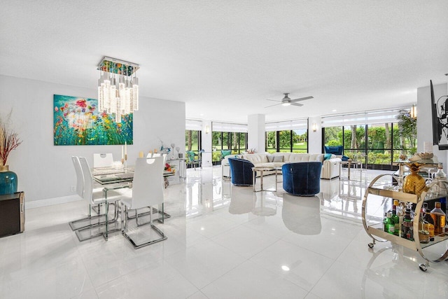 dining area featuring ceiling fan, french doors, light tile patterned flooring, and a textured ceiling