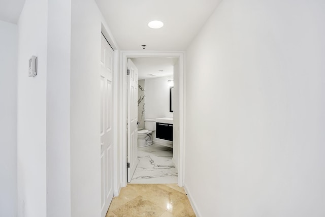 corridor featuring baseboards