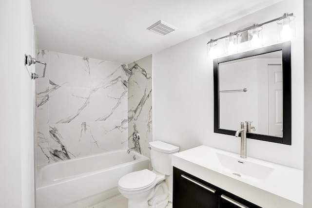 full bathroom featuring vanity, tiled shower / bath, and toilet