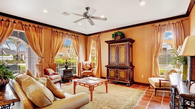 sitting room featuring tile patterned flooring, recessed lighting, visible vents, a ceiling fan, and ornamental molding