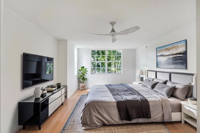 bedroom featuring a ceiling fan and light wood-type flooring