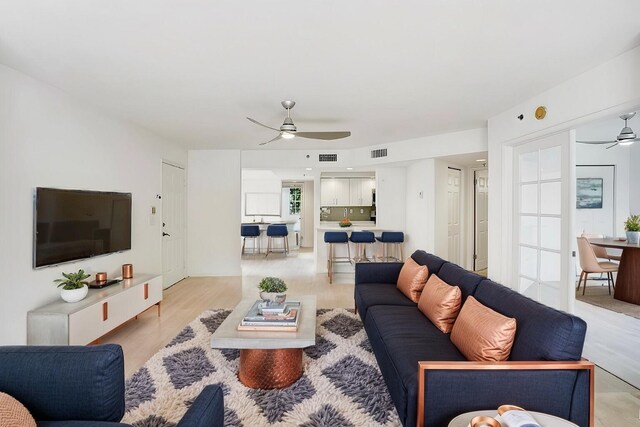 spare room featuring ceiling fan and light wood-type flooring