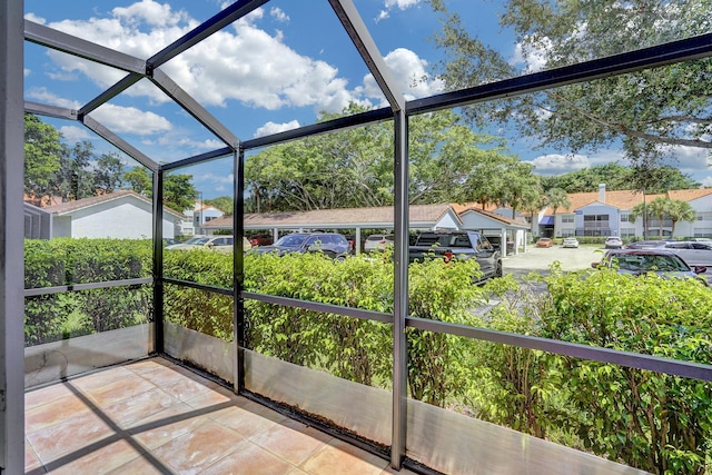 unfurnished sunroom featuring a residential view