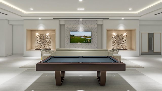 playroom featuring billiards and a raised ceiling