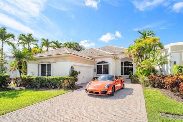 mediterranean / spanish-style house featuring a garage