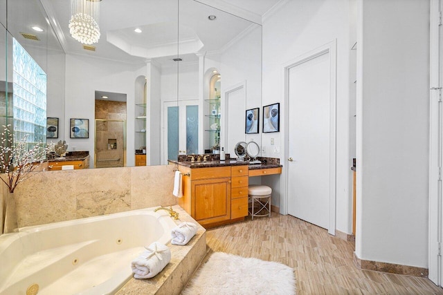 bathroom with independent shower and bath, vanity, wood-type flooring, and ornamental molding