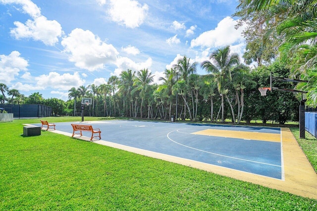 view of basketball court with a lawn