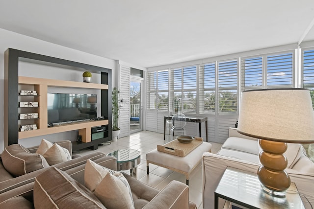 tiled living room featuring floor to ceiling windows and built in features