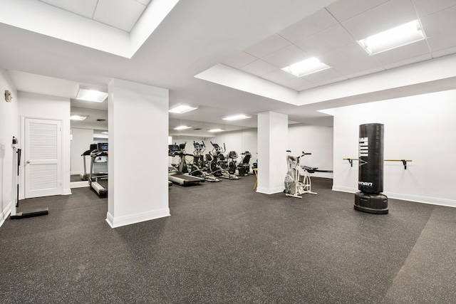 workout area with a paneled ceiling