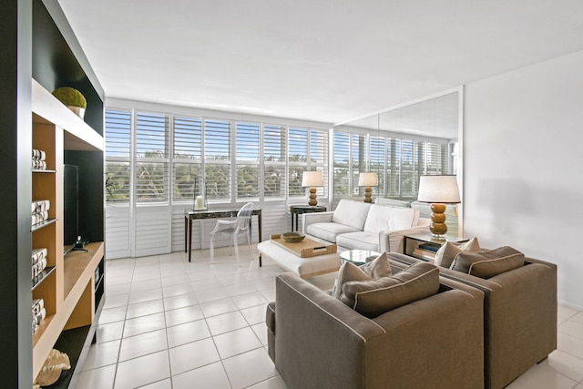 tiled living room with a wall of windows