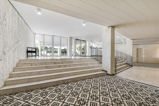 stairway featuring tile patterned flooring