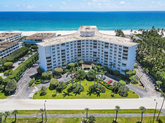 aerial view featuring a view of the beach and a water view