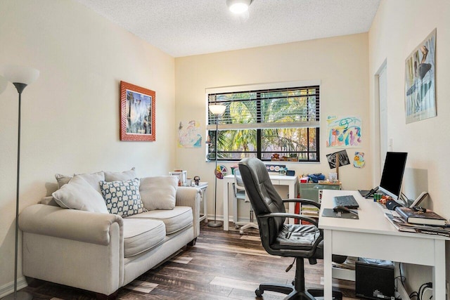 office area featuring dark wood-type flooring and a textured ceiling