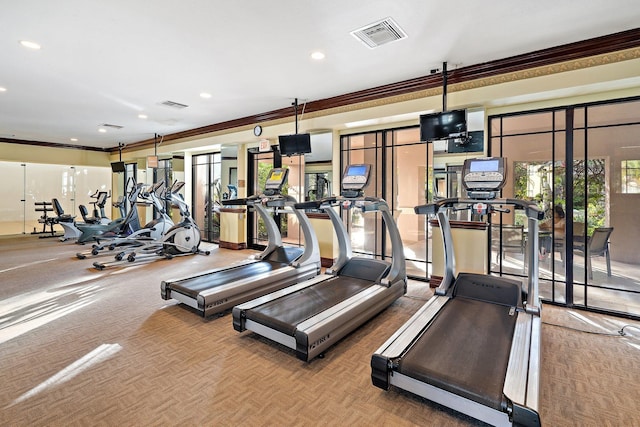 gym with crown molding and parquet flooring