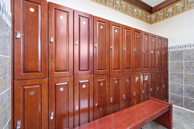 mudroom featuring tile walls and tile patterned floors