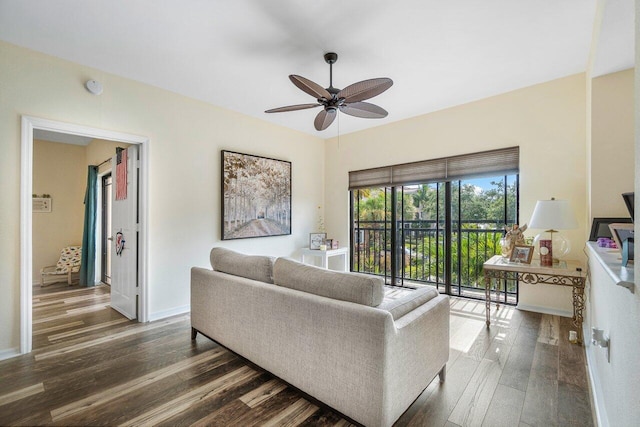 living room featuring wood-type flooring and ceiling fan