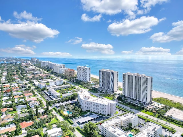 bird's eye view featuring a water view and a beach view