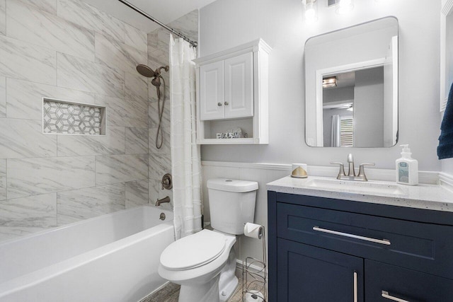 full bathroom featuring vanity, shower / bathtub combination with curtain, and toilet