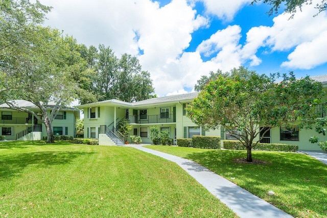 view of front of home with a front lawn