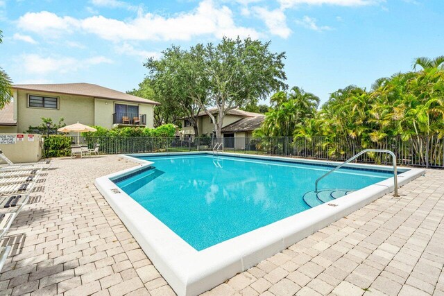 view of swimming pool featuring a patio area