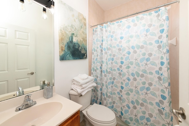 bathroom with vanity, toilet, and a shower with curtain