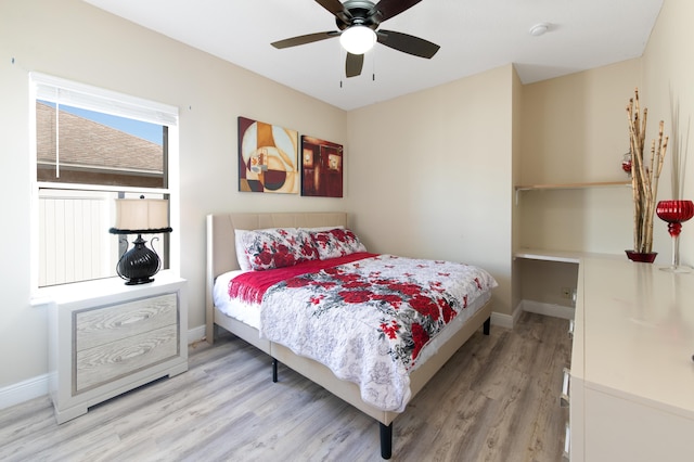 bedroom with baseboards and light wood-style floors