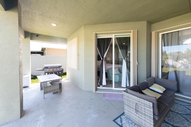 view of patio / terrace with grilling area and fence