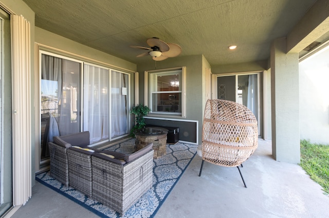 view of patio featuring ceiling fan