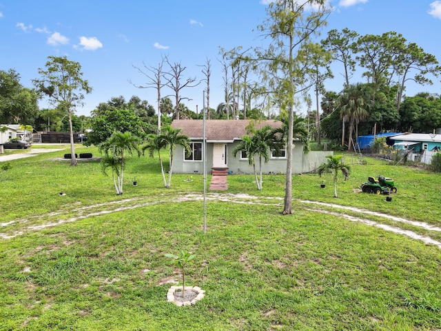 ranch-style home with a front lawn