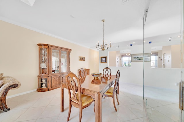 dining space featuring a notable chandelier, light tile patterned floors, and ornamental molding