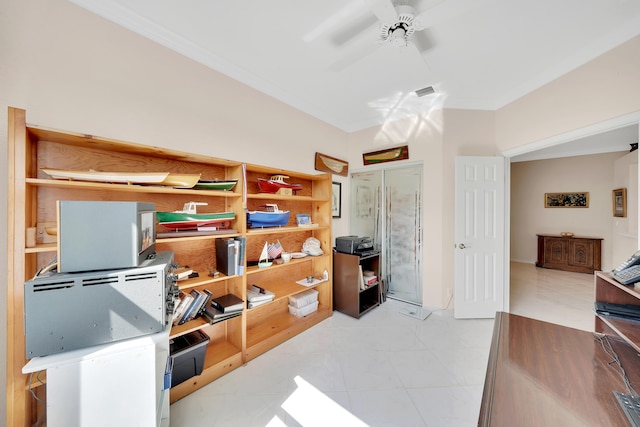 tiled office space featuring ceiling fan and ornamental molding