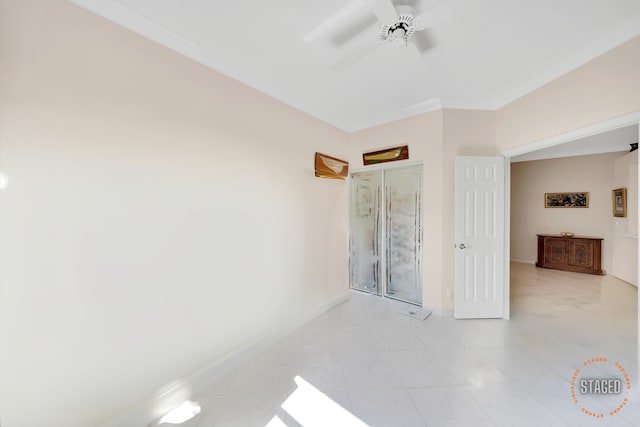 tiled bedroom featuring ceiling fan and ornamental molding