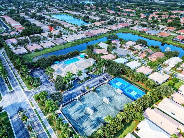 birds eye view of property with a water view