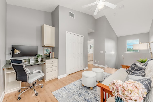 office with ceiling fan, light hardwood / wood-style floors, and high vaulted ceiling