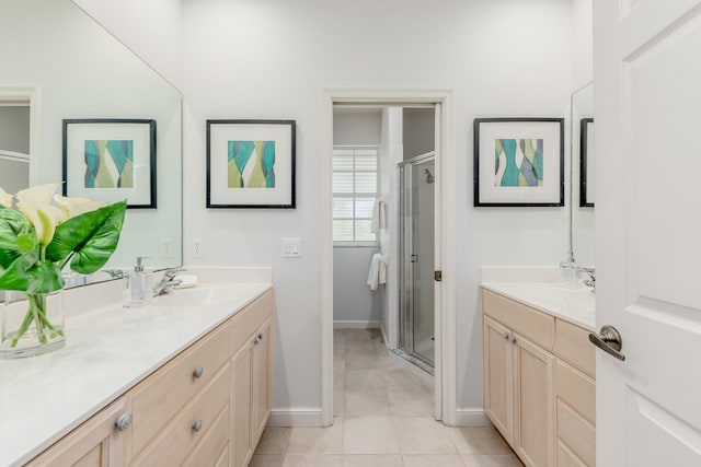 bathroom featuring tile patterned floors, vanity, and walk in shower