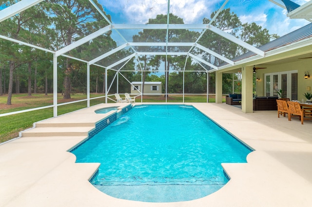 view of swimming pool featuring an outdoor hangout area, a lanai, a yard, an in ground hot tub, and a patio