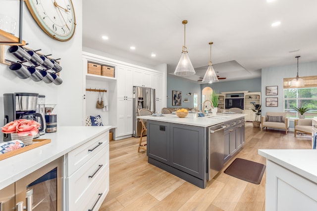 kitchen with light hardwood / wood-style flooring, white cabinetry, and gray cabinetry