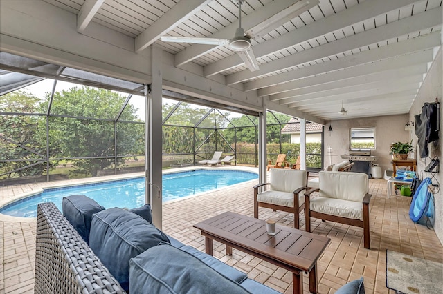 view of pool featuring ceiling fan, an outdoor hangout area, glass enclosure, and a patio area