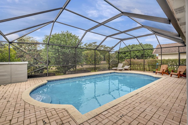 view of pool with a lanai and a patio area