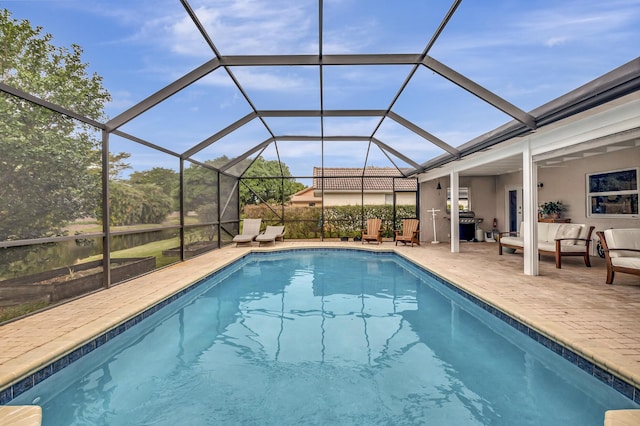 view of swimming pool featuring a patio, a lanai, and outdoor lounge area