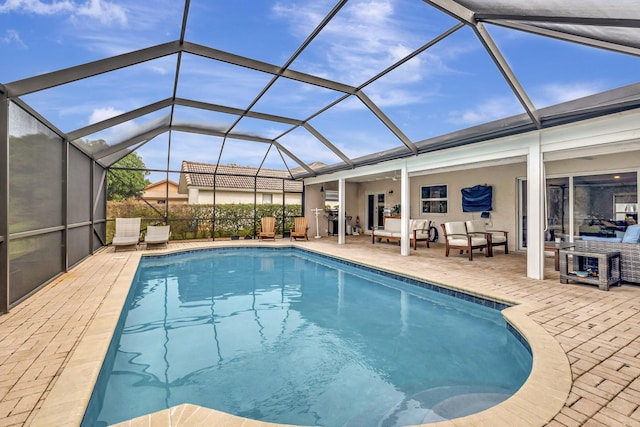 view of swimming pool featuring a lanai, outdoor lounge area, and a patio