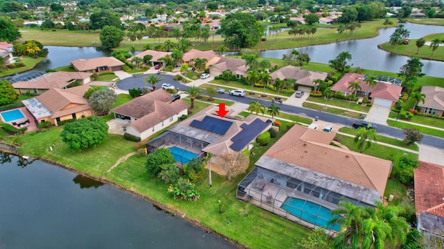 drone / aerial view with a water view