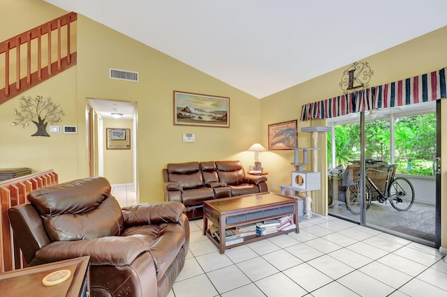 living room featuring vaulted ceiling and light tile patterned floors