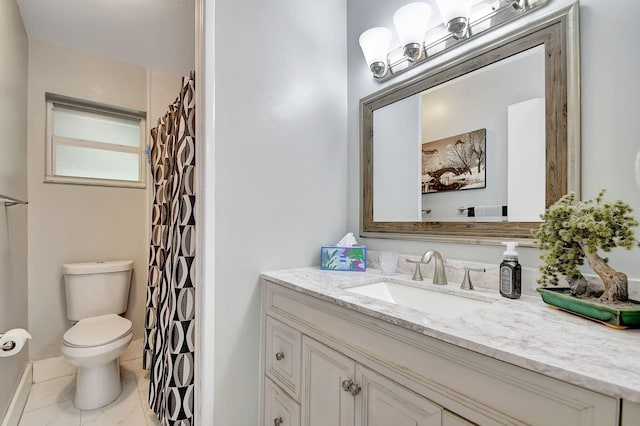 bathroom featuring vanity, toilet, and tile patterned floors