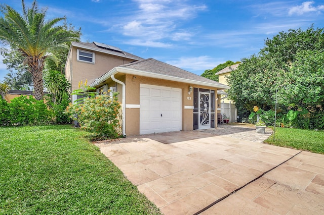 view of property exterior with a lawn, solar panels, and a garage