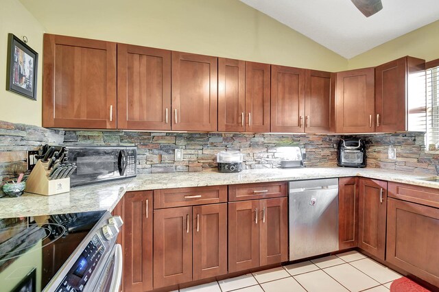 kitchen with decorative backsplash, stainless steel appliances, lofted ceiling, and light stone counters