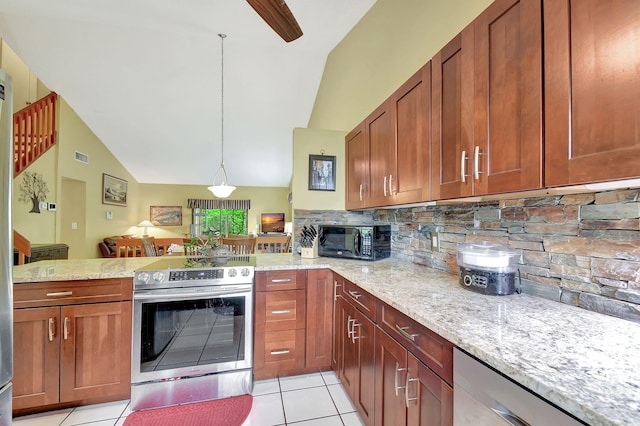 kitchen featuring light tile patterned flooring, kitchen peninsula, backsplash, appliances with stainless steel finishes, and decorative light fixtures